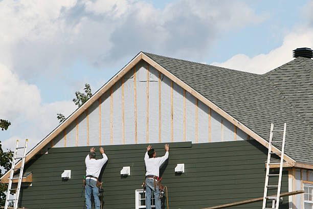 Professional Storm Damage Siding Repair technician working in Armagh, PA